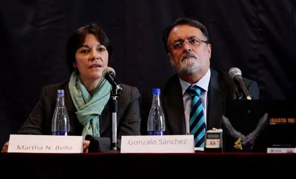 Martha Nubia Bello, coordinadora del infoirme, y el director del Centro Nacional de Memoria Histórica Gonzalo Sánchez
